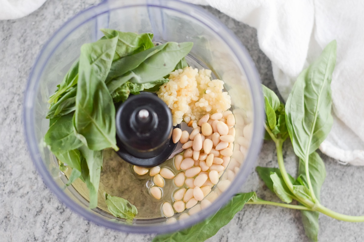 vegan pesto sauce ingredients in food processor