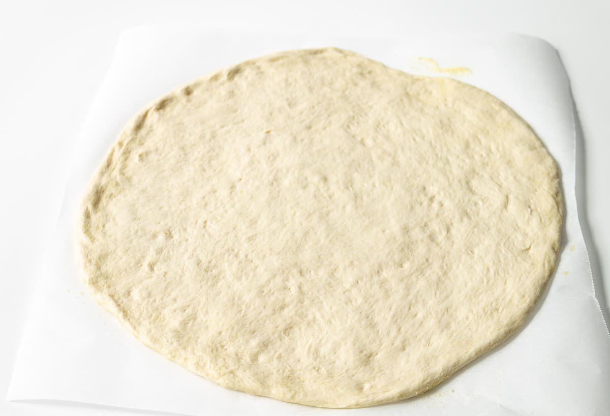 Vegan Pizza dough rolled out into a circle