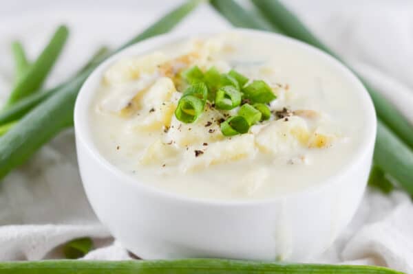creamy vegan potato soup being served