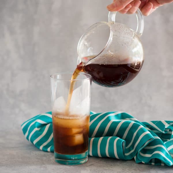 pouring black tea over ice