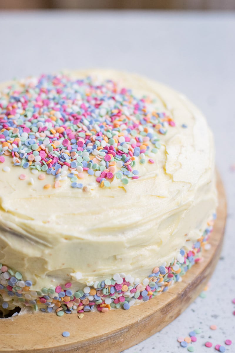 vegan vanilla cake topped with sprinkles