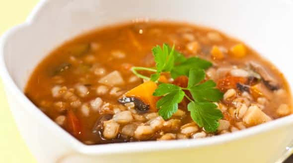 vegetable barley soup being served