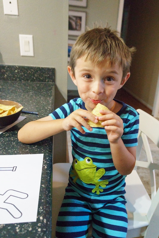 child eating tortilla chips