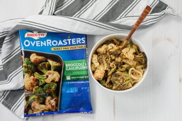 roasted broccoli and cauliflower being served over soba noodles