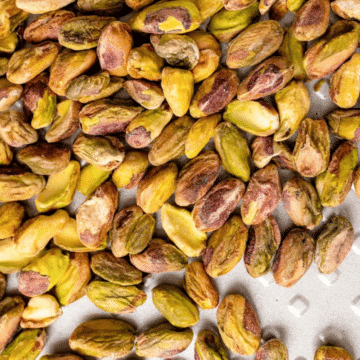 7 Ways to Roast Pistachios: golden roasted pistachios on a baking sheet