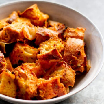 Cheddar pumpkin stuffing in a white bowl