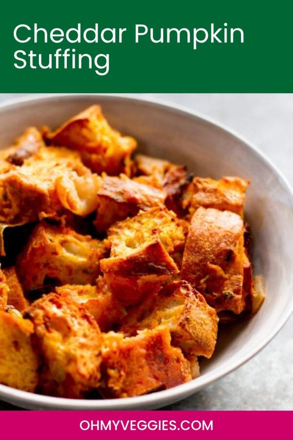 Cheddar Pumpkin Stuffing title over a bowl of golden baked stuffing