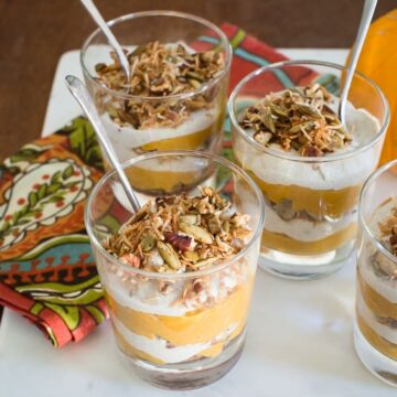 Maple pumpkin parfaits layered with cashew coconut cream and topped with a crunchy pecan and pumpkin seed crumble