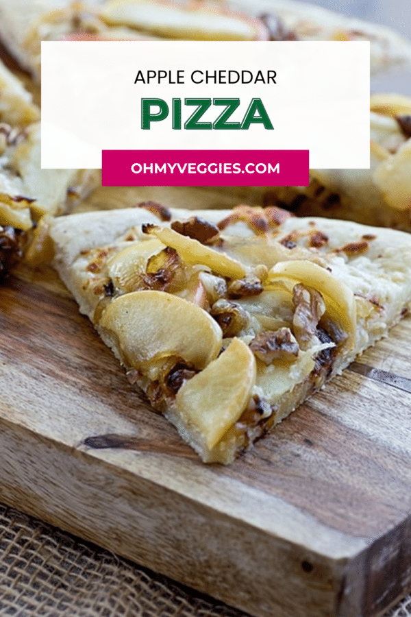 Apple cheddar pizza slice on a wooden board with text overlay for Oh My Veggies