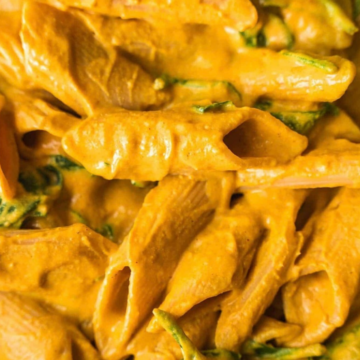 Vegan butternut squash mac and cheese close-up with penne and spinach