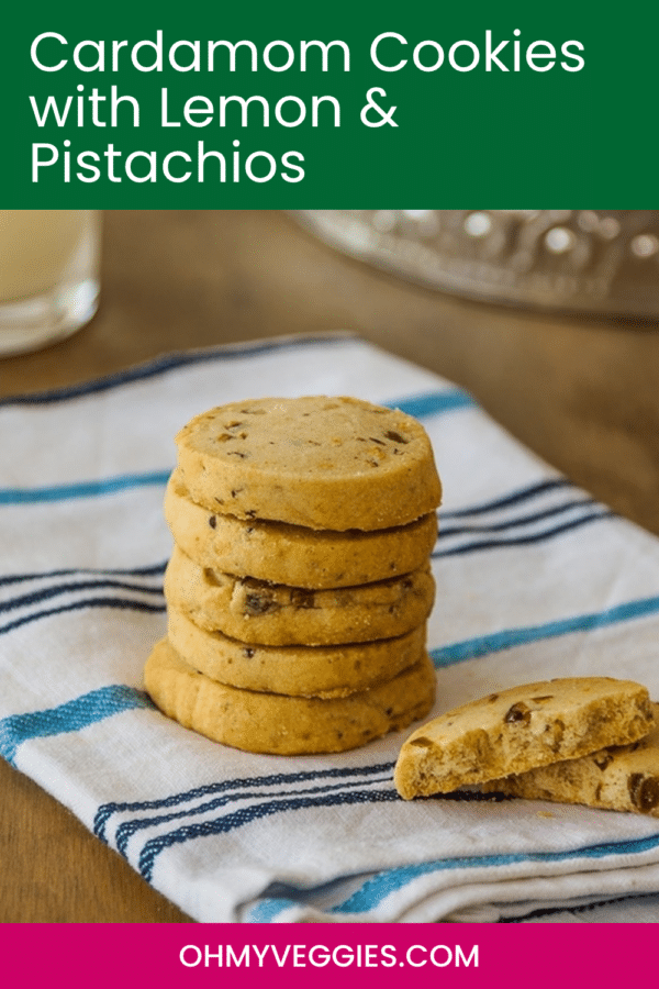 Cardamom Cookies with Lemon and Pistachios pin with a stack of cookies on a blue striped towel