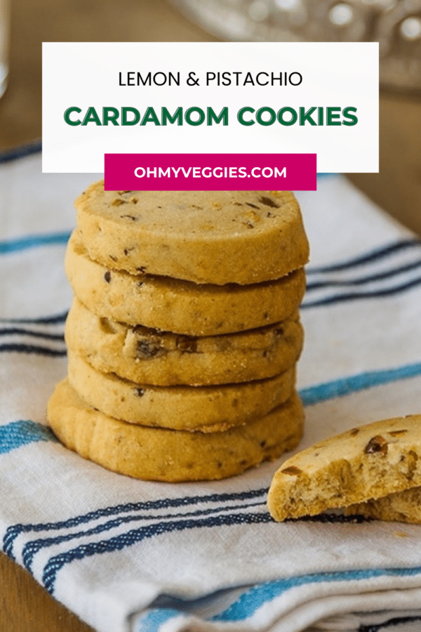 Lemon and pistachio cardamom cookies pin with a close-up of stacked shortbread cookies
