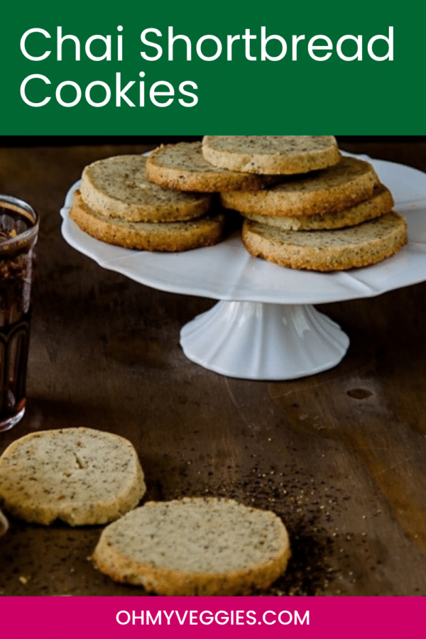 Chai shortbread cookies on a cake stand with the recipe title