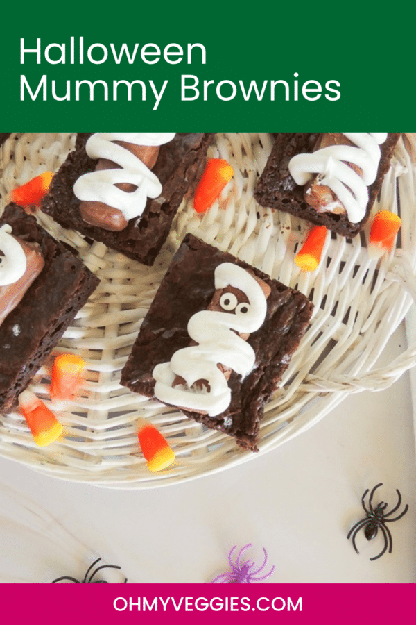 Halloween mummy brownies Pinterest graphic showing brownies on a woven tray with candy corn