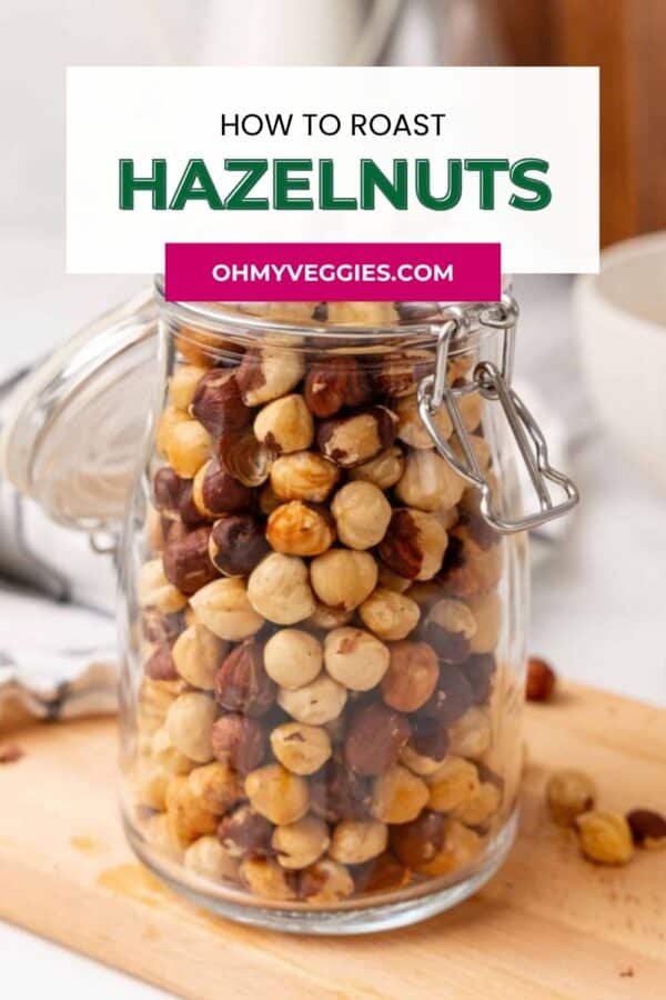 How to roast hazelnuts Pinterest graphic with roasted hazelnuts in a glass jar