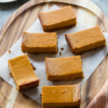Pumpkin pie breakfast bars sliced on a wooden board