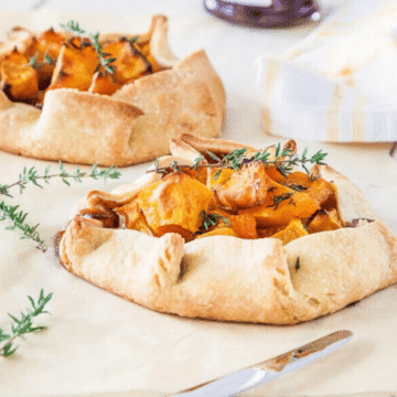 Roasted pumpkin crostata topped with fresh thyme