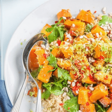 Roasted pumpkin quinoa salad with lime and chili on a white plate