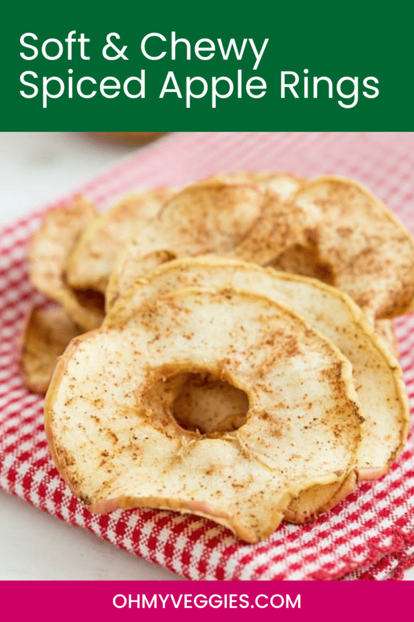 Soft and chewy spiced apple rings on a red and white kitchen towel, Pinterest graphic from Oh My Veggies