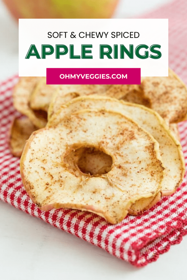 Spiced dried apple rings on a red checked towel with the title Soft and Chewy Spiced Apple Rings