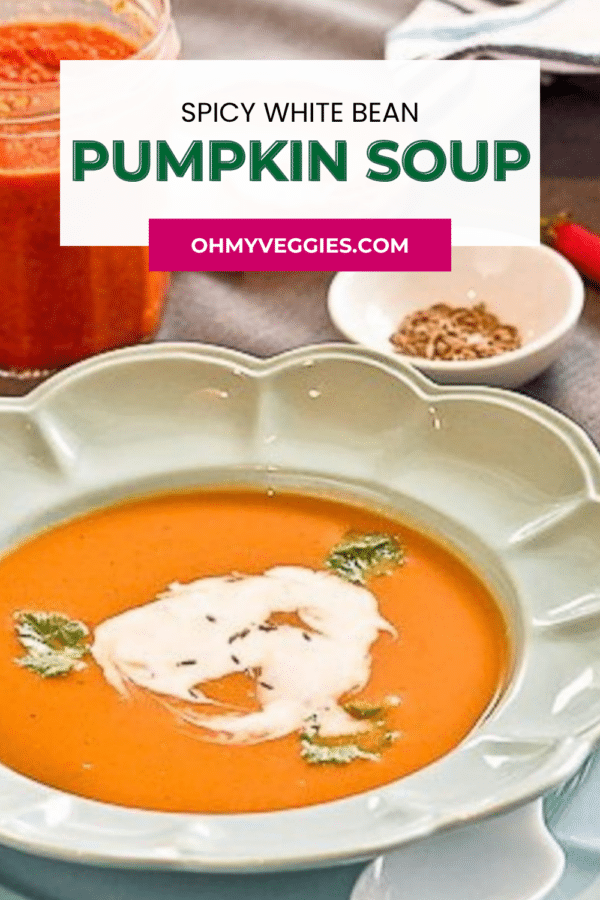 Spicy white bean pumpkin soup Pinterest graphic - close-up of vegan pumpkin soup with coconut milk swirl
