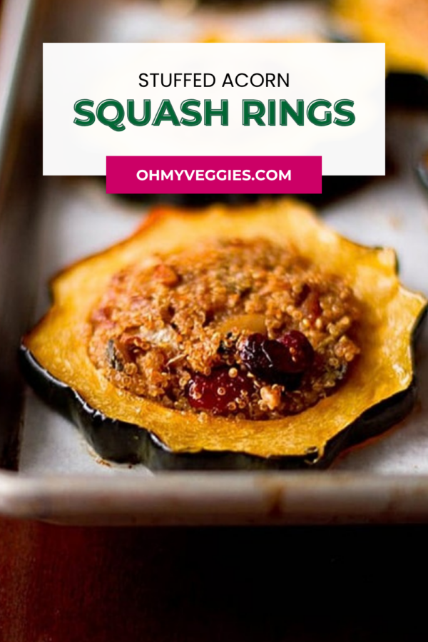 Close-up of a quinoa-stuffed acorn squash ring on a baking sheet with the recipe title