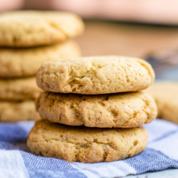 Stack of soft vegan pumpkin cookies on a blue striped napkin