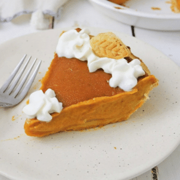 Vegan pumpkin pie with coconut whipped cream