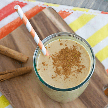 Vegan pumpkin spice smoothie in a glass topped with cinnamon